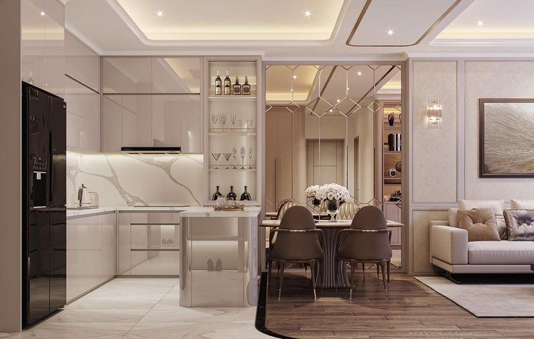 Phối cảnh bếp Neoclassic tủ trên màu be bóng, mặt ốp đá vân, quầy bar có tủ rượu kính cạnh bàn ăn 4 ghế bọc nỉ